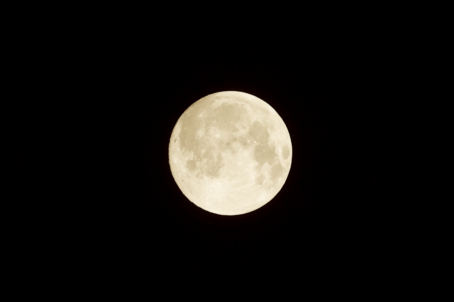 Full moon glowing in the night sky
